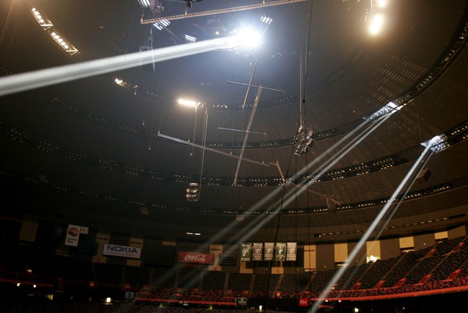 Huge shafts of light filter through the damaged roof of the Louisiana Superdome in New Orleans.